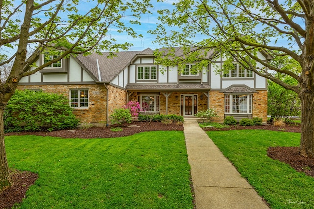 5930 Hillcrest Ct, Downers Grove, IL 60516 - tudor home with roof with shingles, stucco siding, brick siding, and a front yard