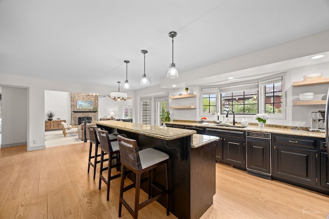 5930 Hillcrest Ct, Downers Grove, IL 60516 - kitchen with a sink, open shelves, a breakfast bar, and light stone countertops