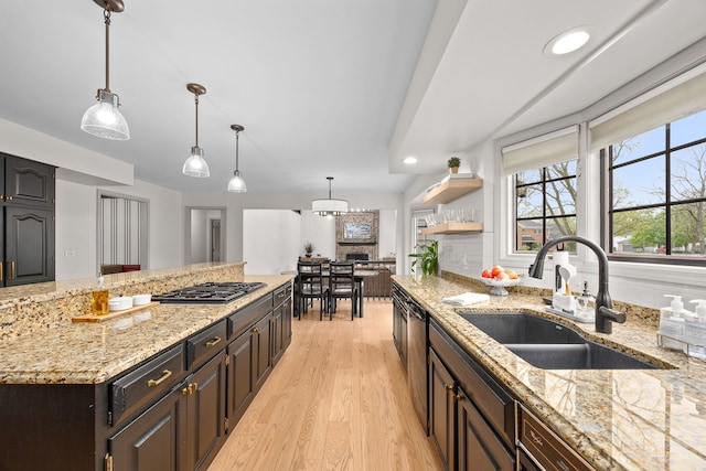 5930 Hillcrest Ct, Downers Grove, IL 60516 - kitchen with a sink, light wood finished floors, stainless steel gas cooktop, recessed lighting, and decorative light fixtures