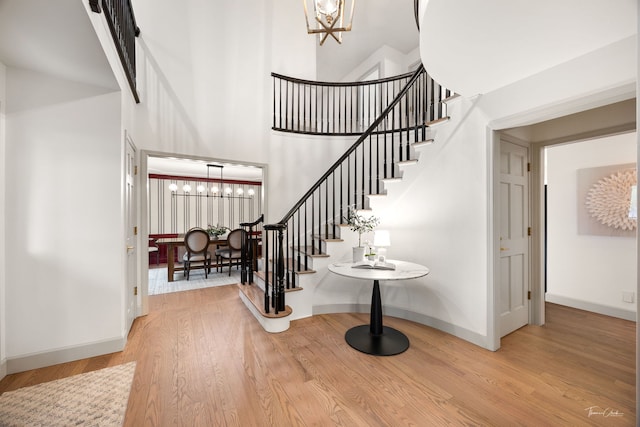 5930 Hillcrest Ct, Downers Grove, IL 60516 - foyer featuring a high ceiling, stairs, and a notable chandelier