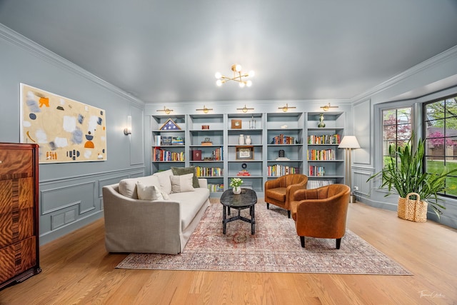 5930 Hillcrest Ct, Downers Grove, IL 60516 - sitting room featuring an inviting chandelier, ornamental molding, a decorative wall, and wood finished floors