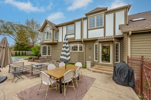 5930 Hillcrest Ct, Downers Grove, IL 60516 - rear view of house featuring fence, a patio, outdoor dining area, an outdoor hangout area, and entry steps