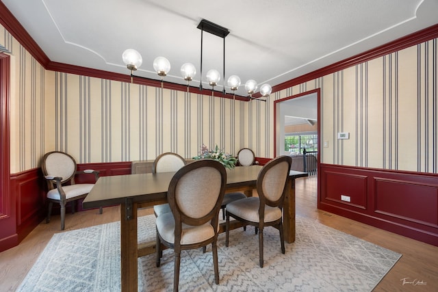 5930 Hillcrest Ct, Downers Grove, IL 60516 - dining space with wood finished floors, ornamental molding, a wainscoted wall, and wallpapered walls