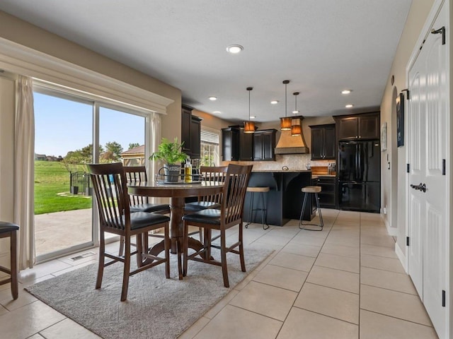 dining room featuring recessed lighting and light tile patterned floors