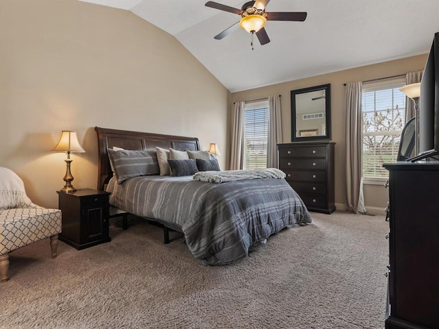 carpeted bedroom with baseboards, multiple windows, ceiling fan, and lofted ceiling