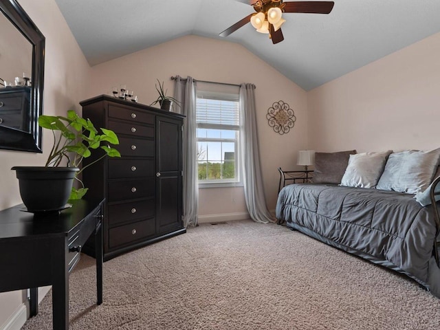bedroom with a ceiling fan, visible vents, vaulted ceiling, baseboards, and light carpet