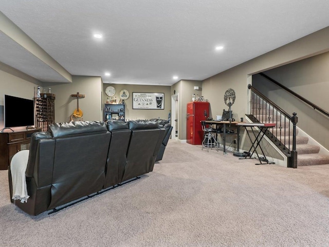 carpeted living room featuring recessed lighting and stairs