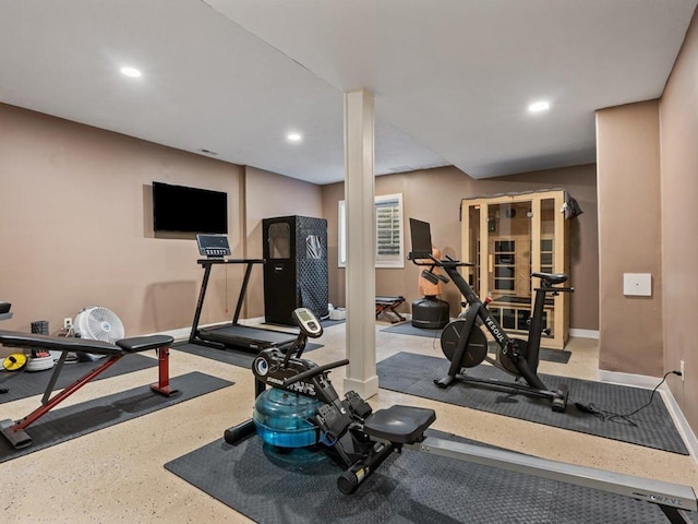 workout area featuring baseboards and recessed lighting
