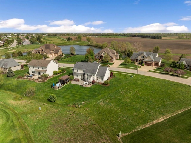 aerial view featuring a water view and a residential view