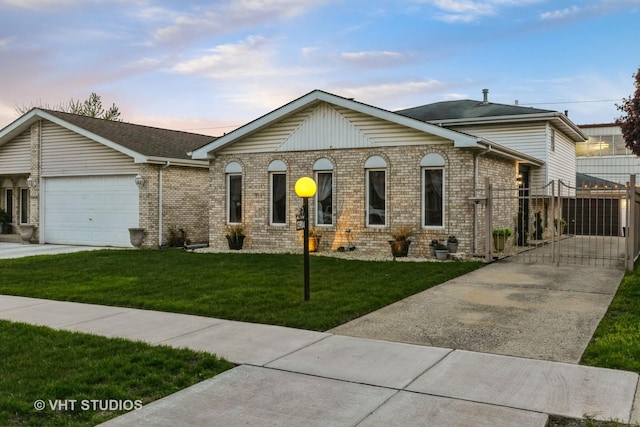 view of front facade with brick siding, a garage, a gate, concrete driveway, and a yard