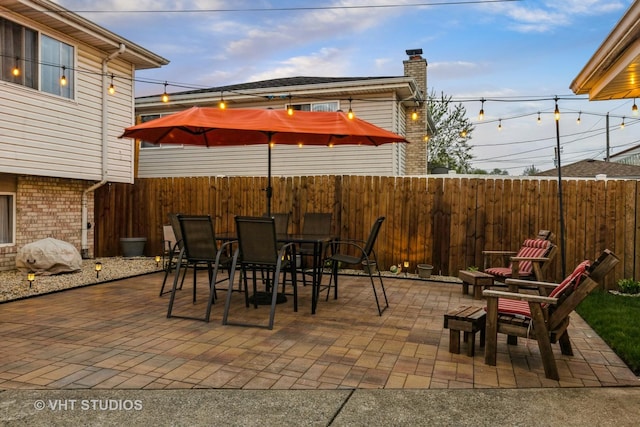 view of patio / terrace featuring outdoor dining area and a fenced backyard