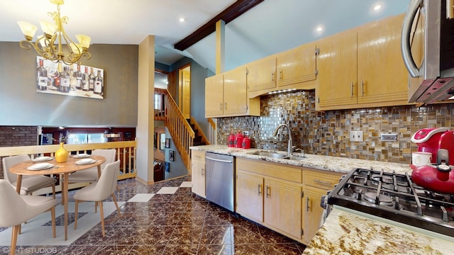 kitchen featuring backsplash, stainless steel appliances, an inviting chandelier, and a sink