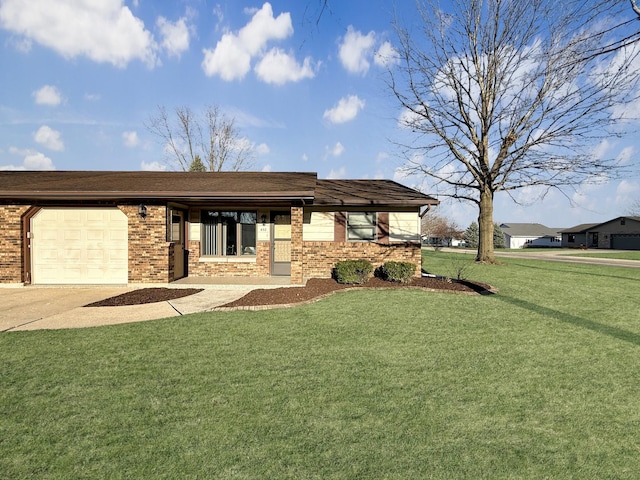 view of front facade with brick siding, a front yard, concrete driveway, and a garage