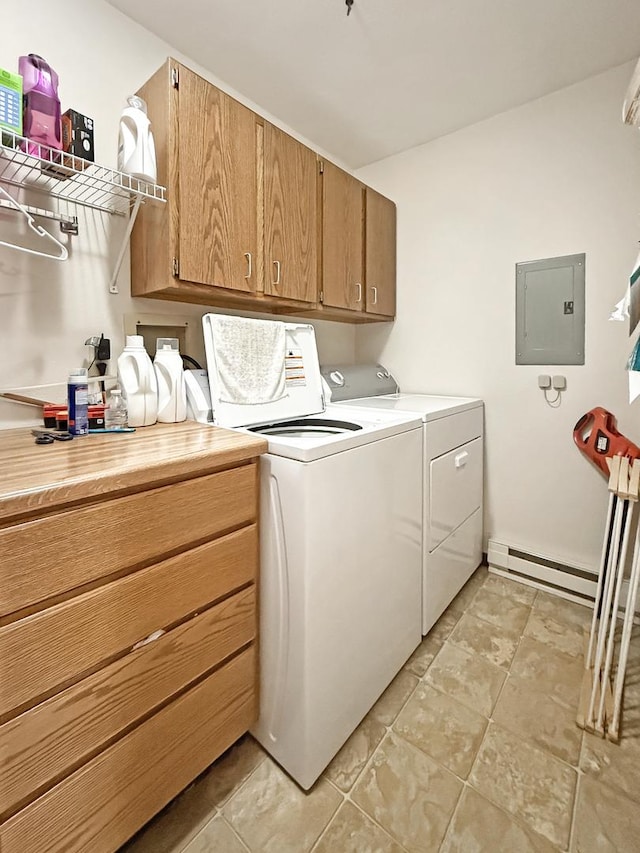 clothes washing area featuring cabinet space, electric panel, baseboard heating, and separate washer and dryer
