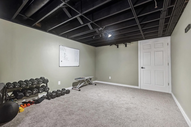 workout room with carpet and baseboards