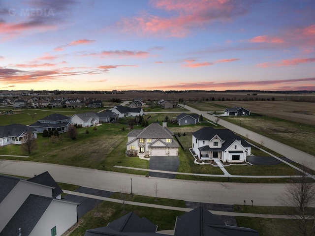 birds eye view of property with a residential view