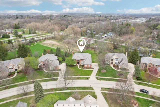 birds eye view of property with a residential view