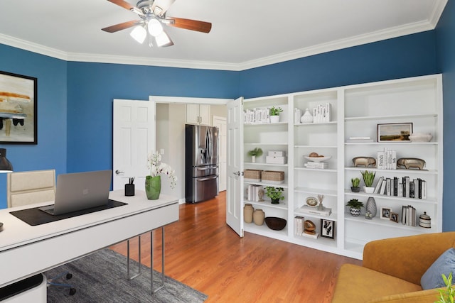 home office featuring crown molding, a ceiling fan, and wood finished floors