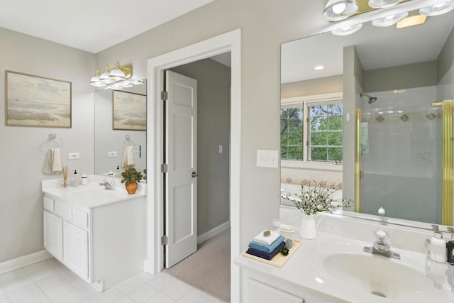 bathroom with tile patterned floors, a tub, vanity, baseboards, and a stall shower