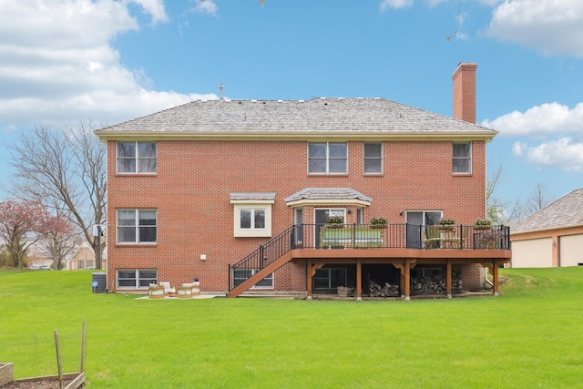 rear view of house with a chimney, a yard, stairs, and a wooden deck