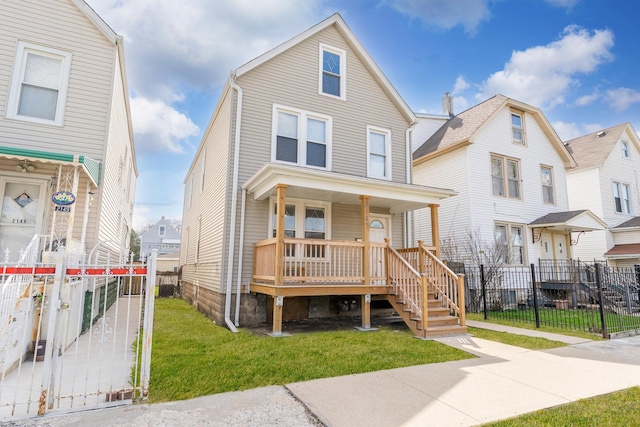 2147 N Latrobe Ave, Chicago, IL 60639 - view of front of house featuring stairway, a front lawn, covered porch, and fence