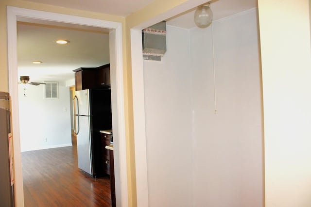 hallway with baseboards, visible vents, recessed lighting, and dark wood-style floors