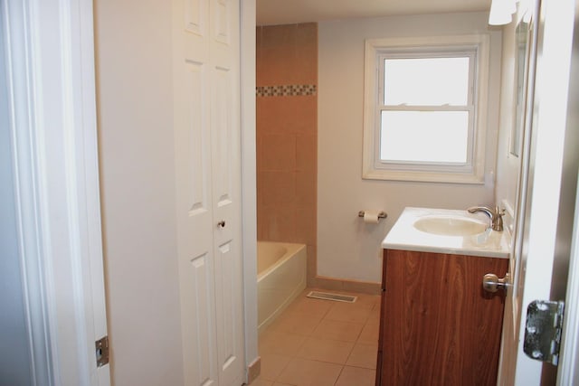full bath with baseboards, vanity, tile patterned floors, and visible vents