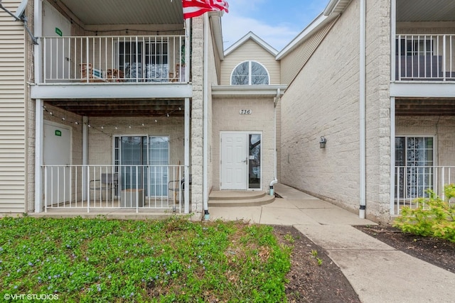 back of property with a balcony