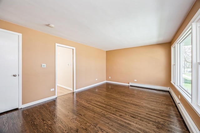 1432 Marengo Ave, Forest Park, IL 60130 - spare room featuring a baseboard radiator, wood finished floors, baseboards, and baseboard heating
