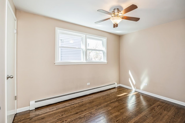 1432 Marengo Ave, Forest Park, IL 60130 - spare room with a baseboard heating unit, wood finished floors, a ceiling fan, and baseboards