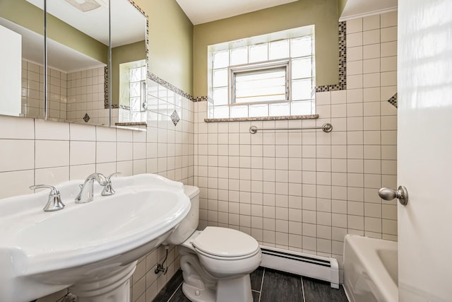 1432 Marengo Ave, Forest Park, IL 60130 - bathroom with a baseboard radiator, wood finished floors, a sink, tile walls, and toilet