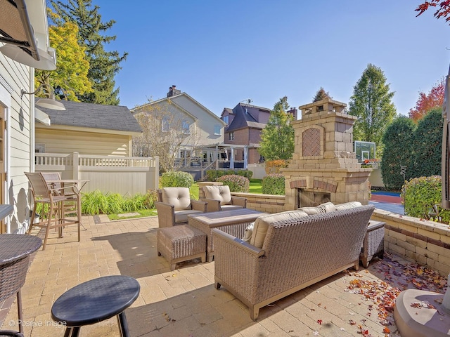 view of patio / terrace with outdoor lounge area, a residential view, and fence