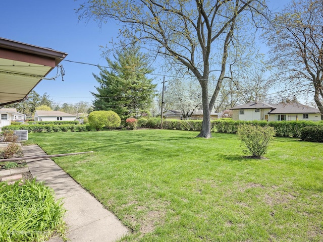 view of yard featuring central AC unit