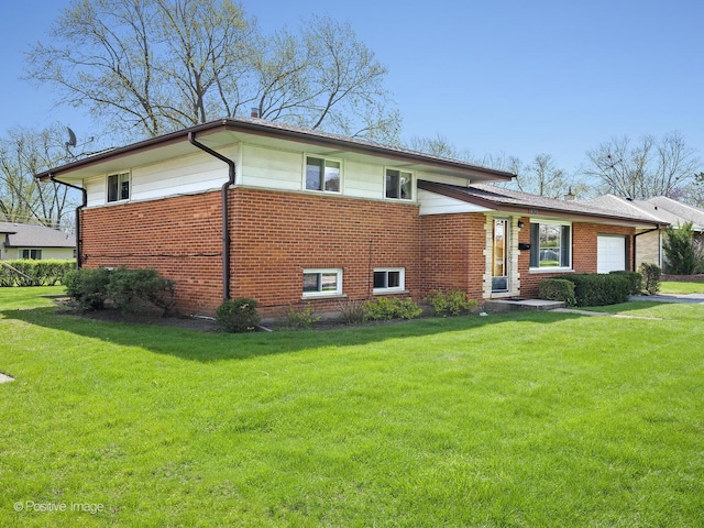 exterior space with a lawn, brick siding, and a garage
