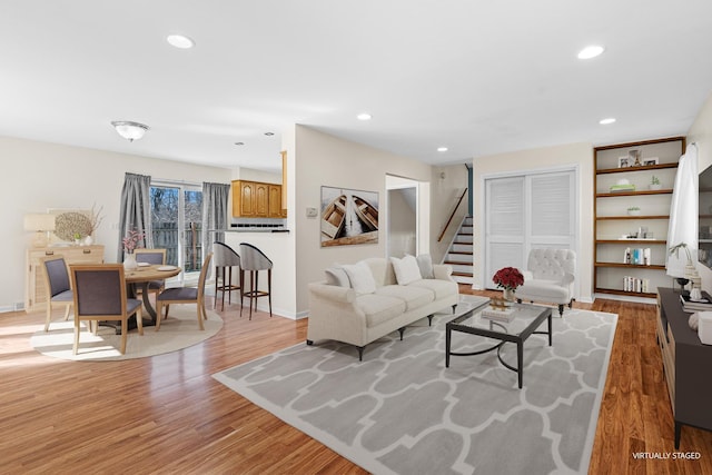 48 Hackberry Ln, Glenview, IL 60025 - living room featuring recessed lighting, light wood-style floors, and stairs