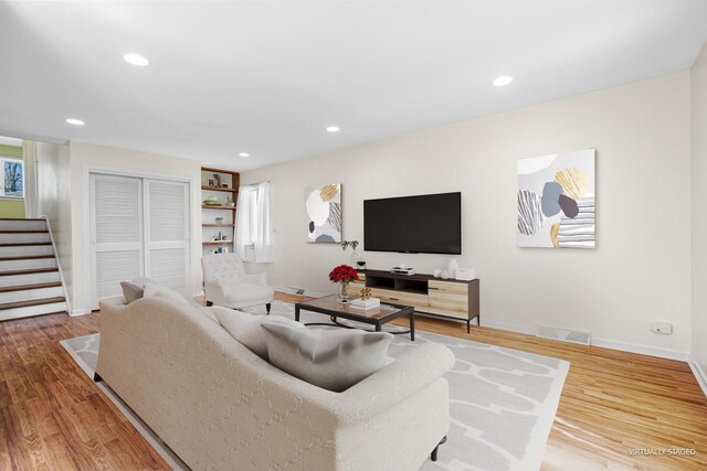 48 Hackberry Ln, Glenview, IL 60025 - living area with baseboards, wood finished floors, recessed lighting, and stairs