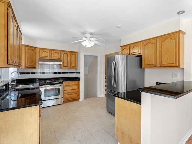 48 Hackberry Ln, Glenview, IL 60025 - kitchen with stainless steel appliances, a sink, backsplash, a ceiling fan, and under cabinet range hood