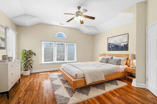 48 Hackberry Ln, Glenview, IL 60025 - bedroom with vaulted ceiling, visible vents, light wood-style floors, and ceiling fan