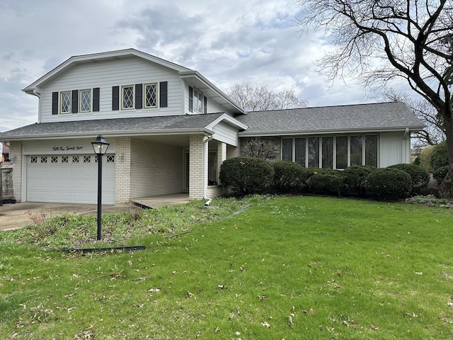 tri-level home with a front yard, brick siding, a shingled roof, an attached garage, and driveway