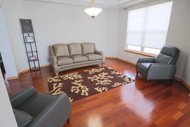 living room featuring baseboards and wood finished floors