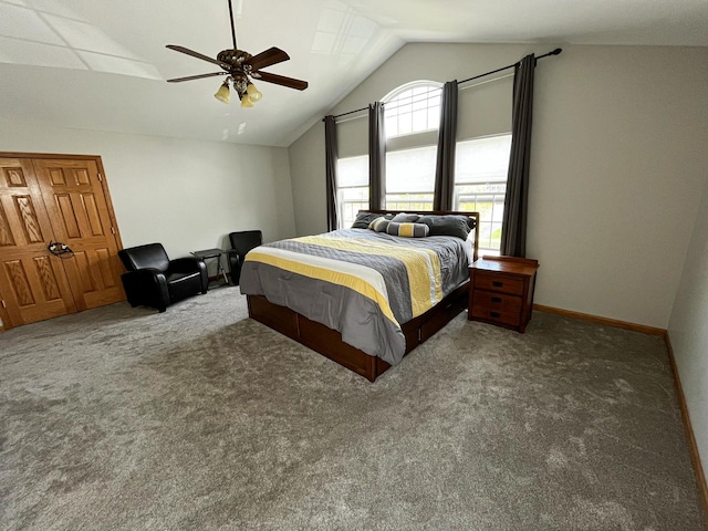 bedroom with ceiling fan, vaulted ceiling, and carpet