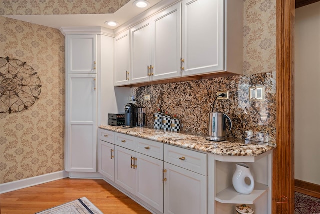 1330 Kurtis Ln, Lake Forest, IL 60045 - kitchen with baseboards, open shelves, light wood-type flooring, wallpapered walls, and light stone counters