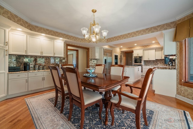 1330 Kurtis Ln, Lake Forest, IL 60045 - dining room featuring a chandelier, light wood-style floors, and crown molding