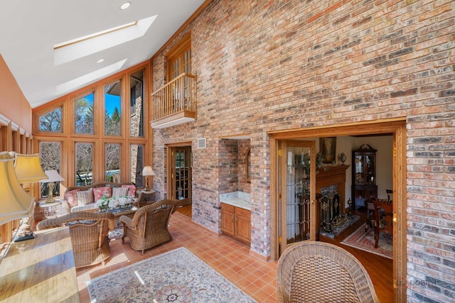 1330 Kurtis Ln, Lake Forest, IL 60045 - living area featuring a high ceiling, a skylight, light tile patterned flooring, and brick wall