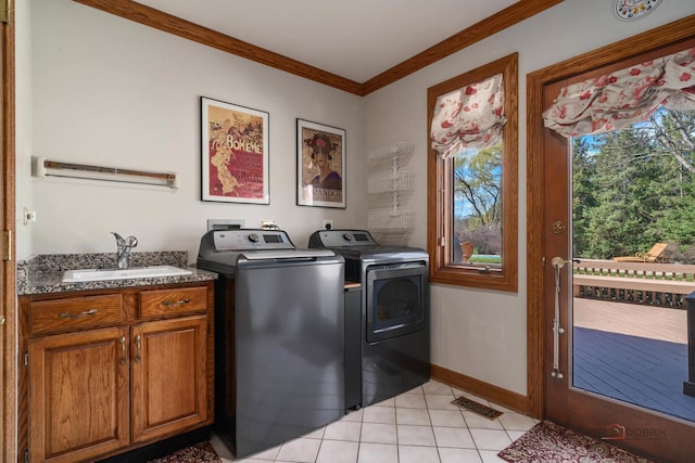 1330 Kurtis Ln, Lake Forest, IL 60045 - washroom featuring a sink, washer and dryer, crown molding, light tile patterned floors, and baseboards