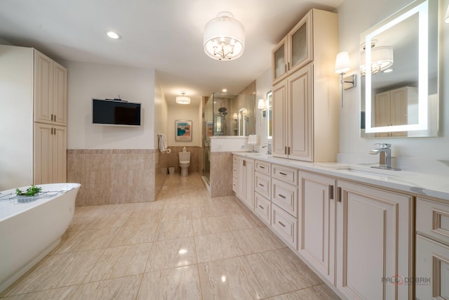 1330 Kurtis Ln, Lake Forest, IL 60045 - full bath featuring a shower stall, double vanity, a chandelier, a freestanding bath, and tile walls