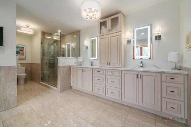 1330 Kurtis Ln, Lake Forest, IL 60045 - full bath featuring double vanity, a shower stall, a chandelier, and toilet