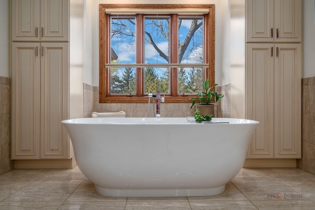 1330 Kurtis Ln, Lake Forest, IL 60045 - full bathroom featuring tile walls, a freestanding bath, wainscoting, and a closet
