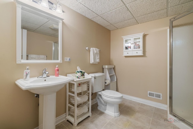1330 Kurtis Ln, Lake Forest, IL 60045 - full bath featuring a drop ceiling, a stall shower, toilet, baseboards, and tile patterned flooring