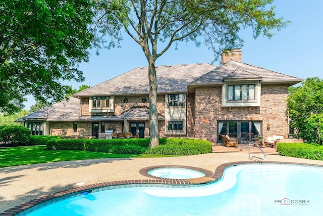 1330 Kurtis Ln, Lake Forest, IL 60045 - outdoor pool with an in-ground hot tub, a patio area, and french doors